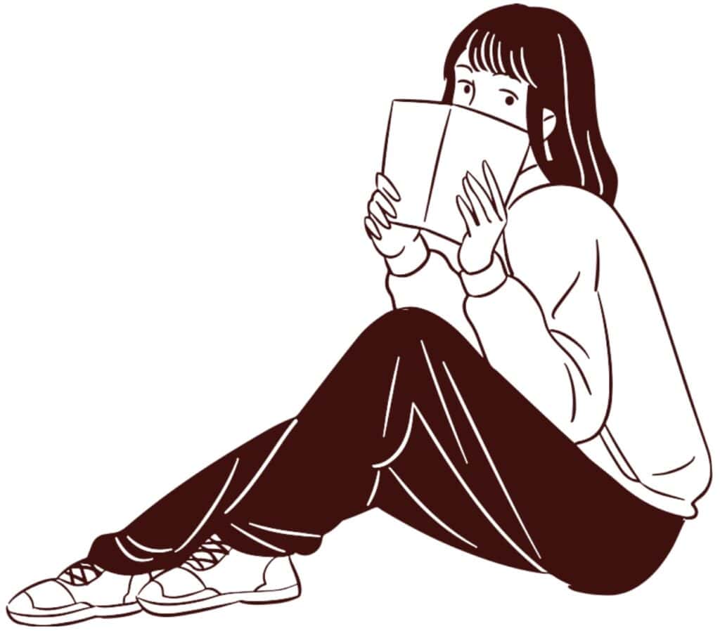 Stylish girl reading a book, sitting casual in modern fashion, perfect for fashion and lifestyle blogs.